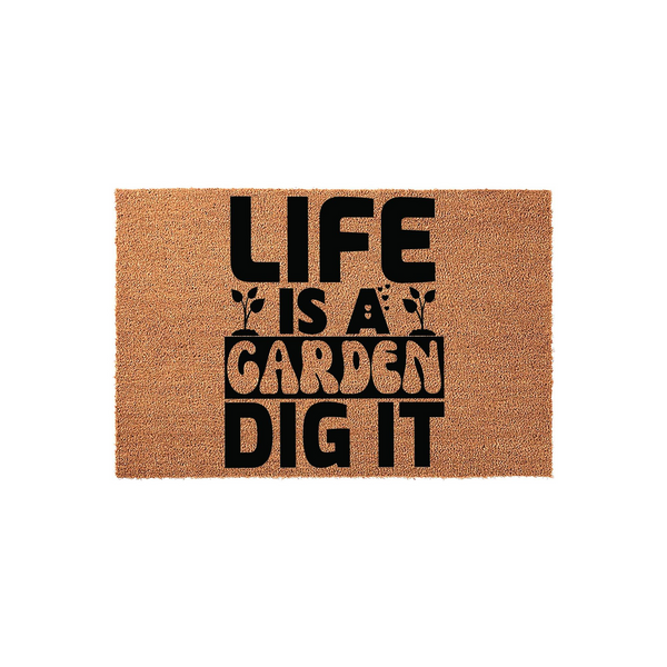 Life Is A Garden Dig It coir doormat featuring bold black typography printed on a natural tan fiber background, creating a fun and welcoming outdoor entrance decor piece for any gardening enthusiast or plant lover to enjoy at
