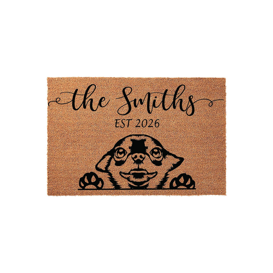 Personalized Chihuahua doormat featuring a cute dog peeking over the bottom edge with black paw prints, customized with a family name and established year printed in elegant black script on a natural tan coir fiber background.
