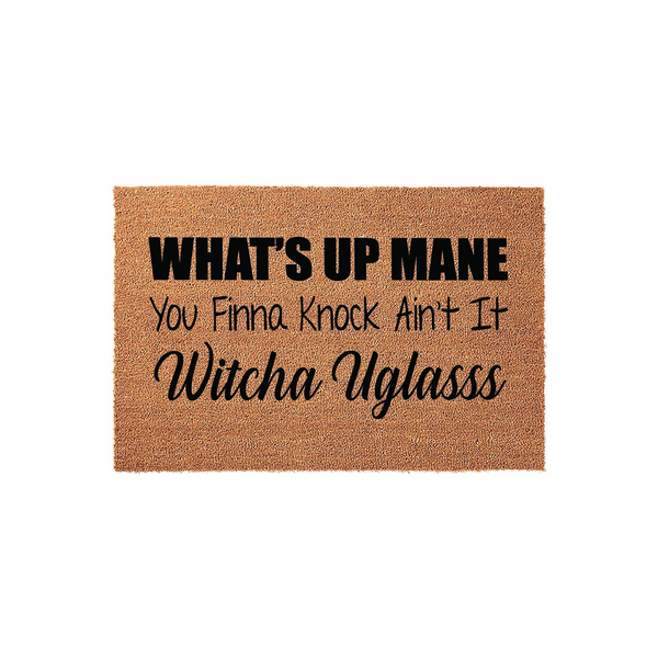 Funny Welcome Doormat with the text What's Up Mane You Finna Knock Ain't It Witcha Uglasss printed in black ink on a natural tan coir fiber mat, featuring a humorous greeting for your front porch entrance on a clean white