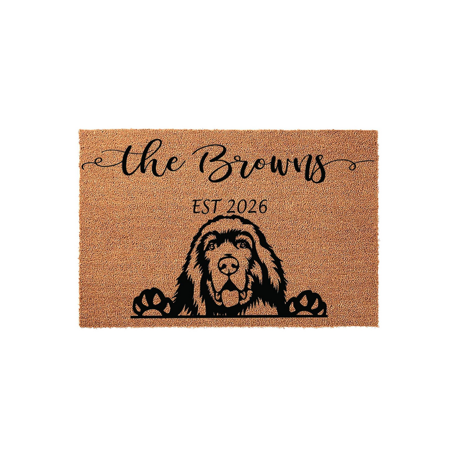 Personalized Newfoundland dog doormat featuring a cute illustrated dog peeking over the bottom edge, customized with a family name and established year on a natural coir fiber background for a welcoming front porch entrance.