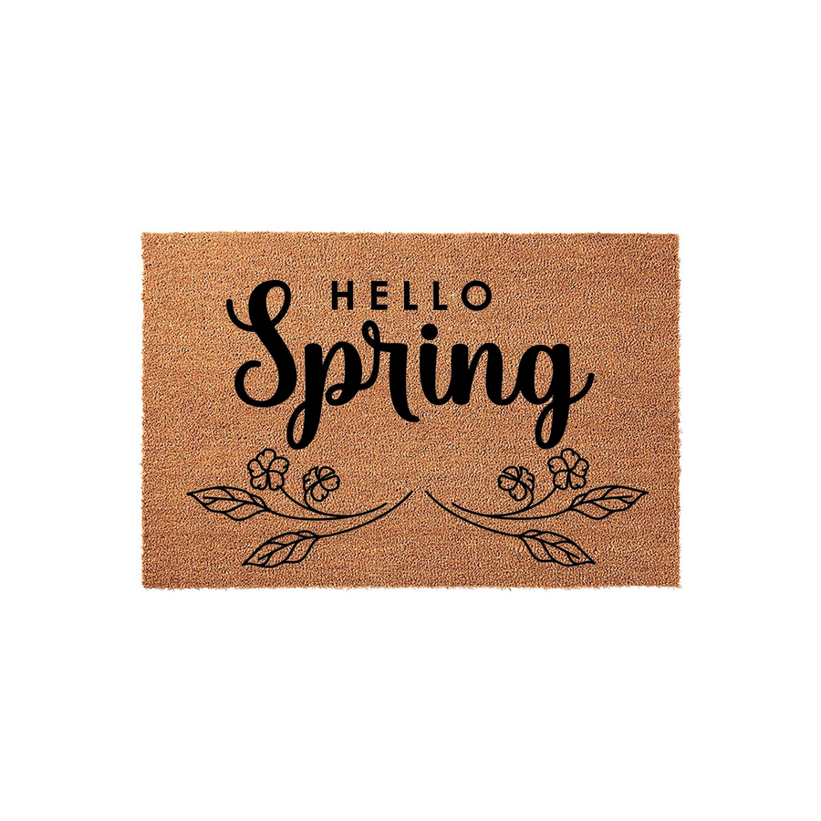 Hello Spring coir doormat featuring a natural tan fiber texture with black printed text and a delicate floral vine design, creating a welcoming seasonal entryway accent for your front porch decor on a clean white background.