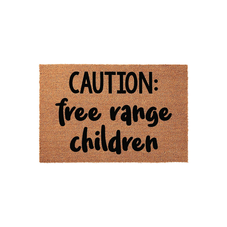 Caution Free Range Children doormat featuring a natural coir texture and bold black lettering, designed as a humorous front porch welcome mat for families who enjoy a fun and playful home decor style for their entryway or front