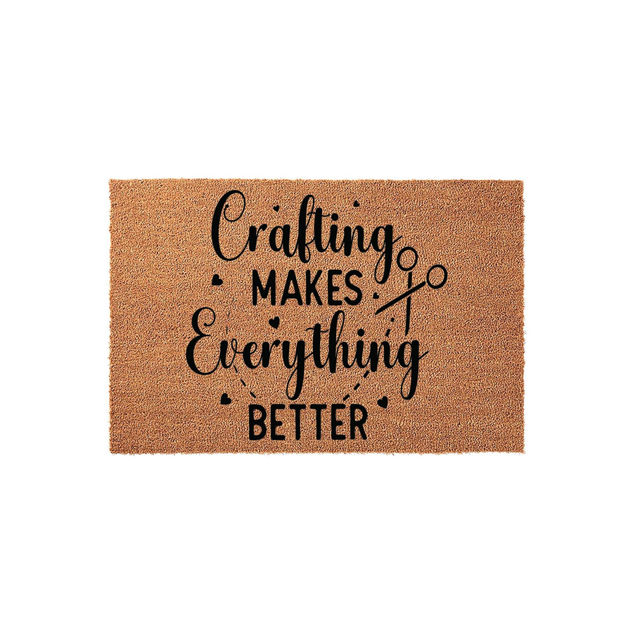 Crafting Makes Everything Better coir doormat featuring a natural tan fiber texture and black printed text with a small pair of scissors icon, perfect for a creative hobby room or a crafter's home entrance on a plain white