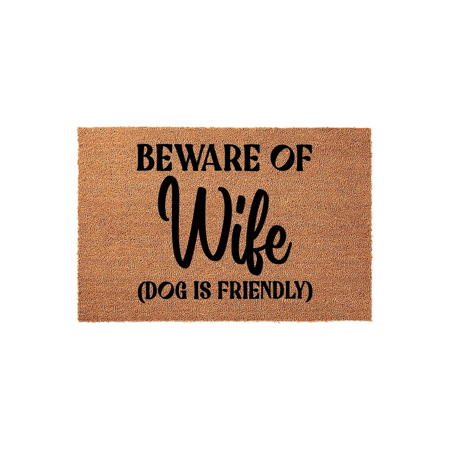 Beware of Wife Dog Is Friendly doormat made of natural coir fibers with a humorous black printed message, featuring a funny quote that makes a great entryway floor mat for any home with a dog and a sense of humor about family