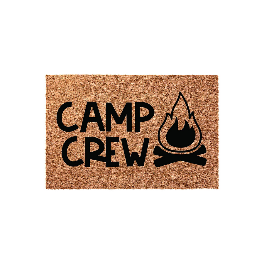 Camp Crew coir doormat featuring a bold black campfire graphic and modern lettering on a natural tan fiber background, creating a fun outdoor welcome mat for campers, RV owners, and anyone who loves spending time in the great
