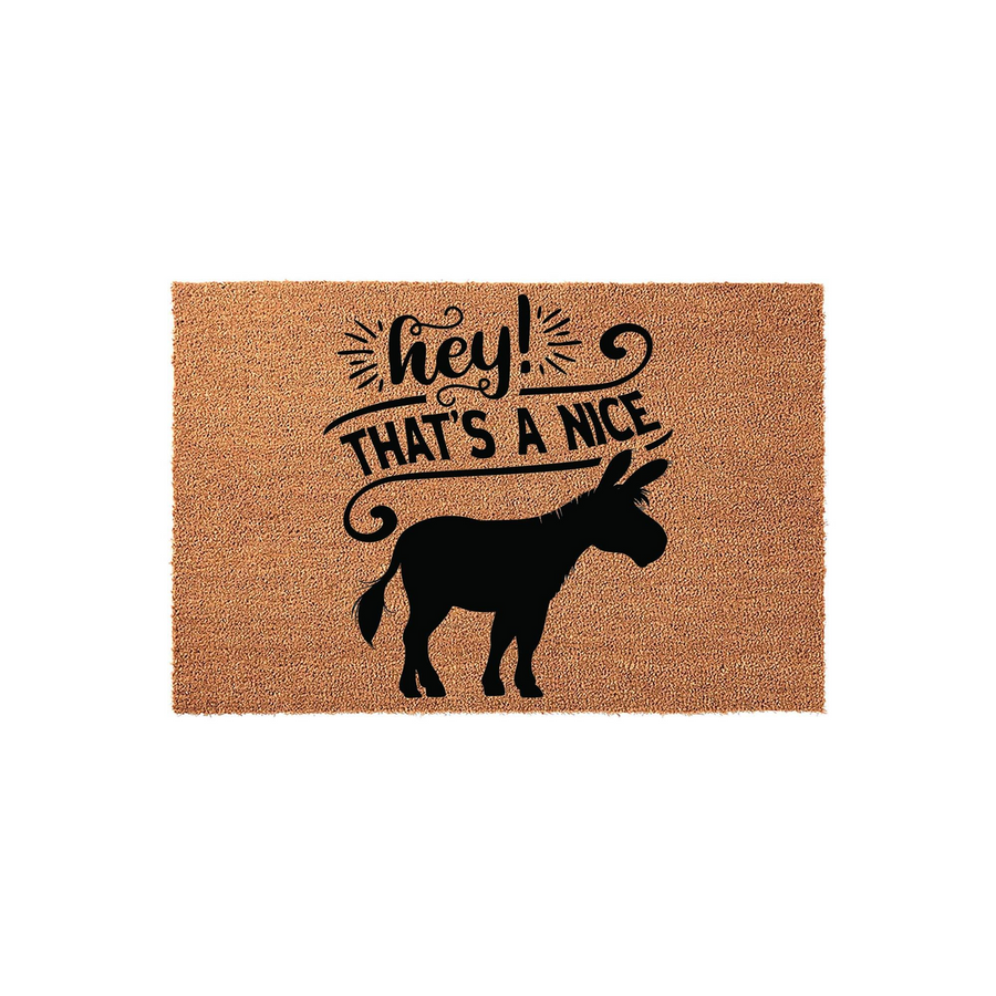 Funny Donkey Welcome Doormat featuring a natural coir texture and a black silhouette of a donkey, with the playful text Hey That Is A Nice Donkey printed in a mix of script and bold fonts for a charming front porch decor accent.
