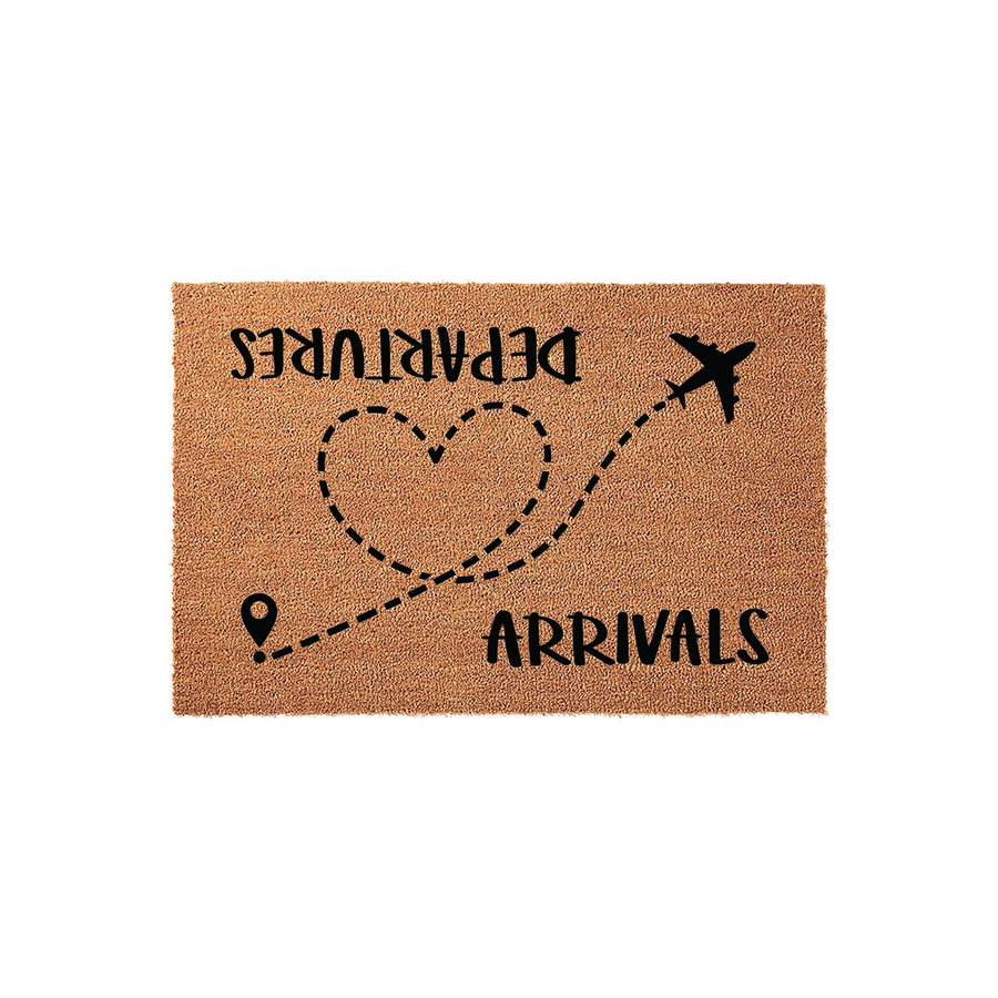 Travel Themed Arrivals and Departures Doormat featuring a natural coir texture with a black printed design of a dashed flight path forming a heart shape, connecting a location pin to an airplane icon on a clean white studio