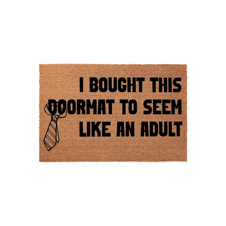 Funny Adulting Doormat featuring a natural coir texture with bold black text that reads I BOUGHT THIS DOORMAT TO SEEM LIKE AN ADULT, accompanied by a simple line-art illustration of a necktie on the left side against a plain