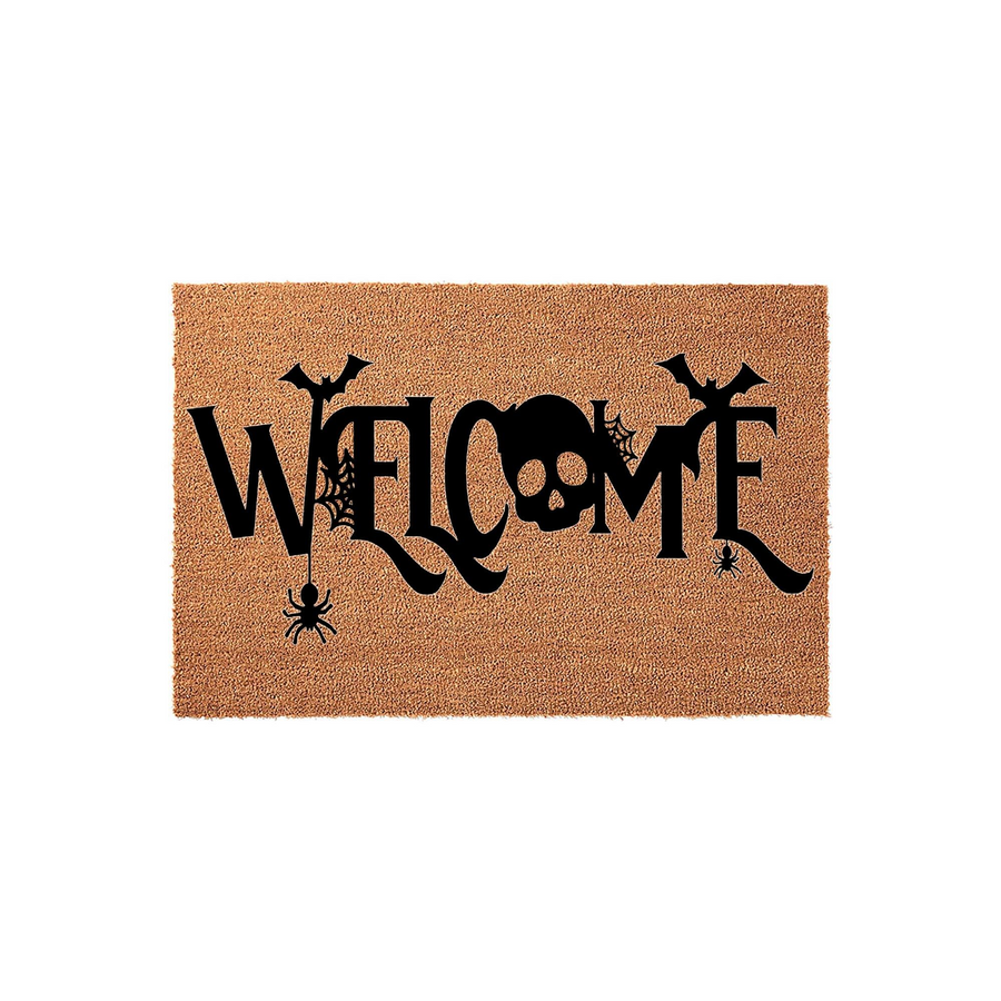Halloween Welcome Doormat featuring a natural coir texture with a black printed design that includes a skull, bats, and spiders hanging from webs, creating a spooky and festive entryway decoration for the fall season on a plain