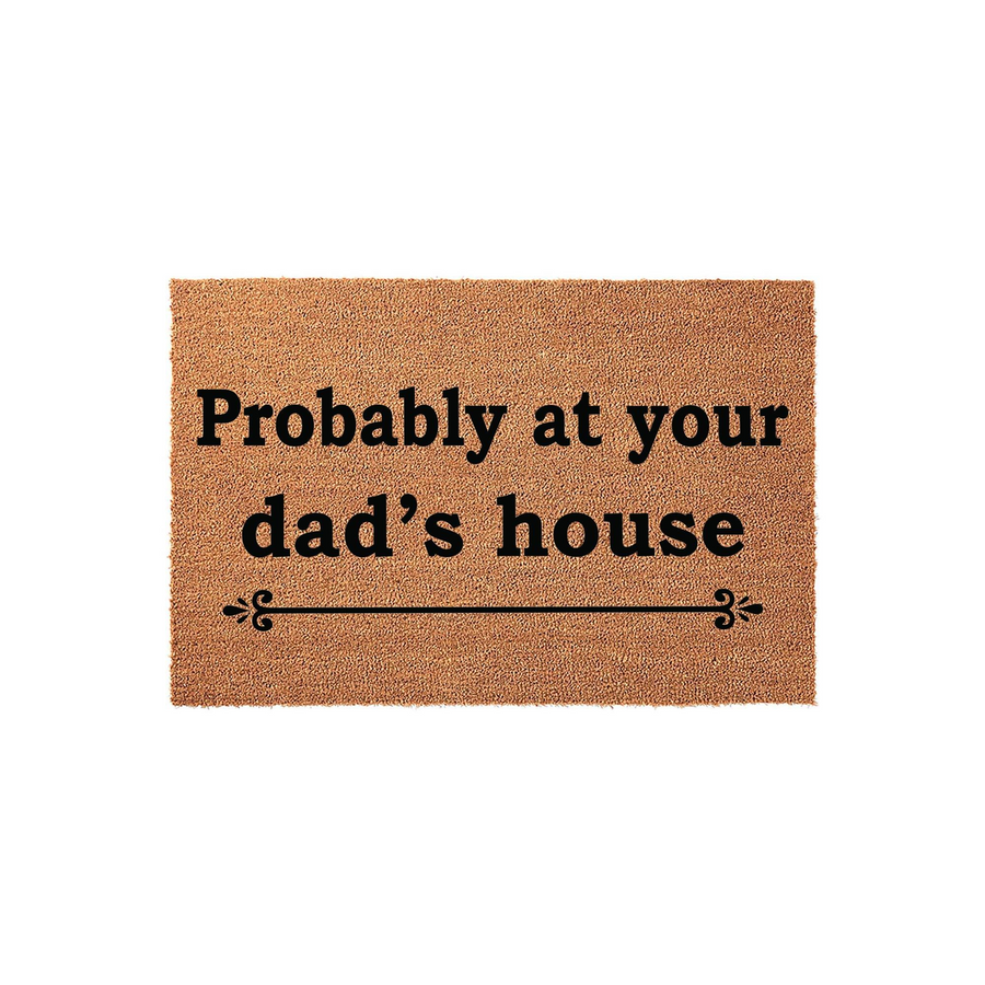 Dad's House Funny Coir Doormat featuring the text Probably at your dad's house in bold black lettering on a natural brown fiber background, accented with a decorative flourish line centered below the humorous message for a front