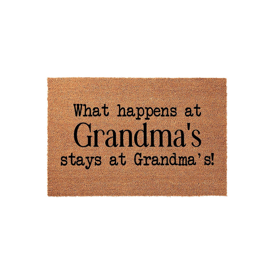 Grandma coir doormat featuring the playful text What happens at Grandma's stays at Grandma's printed in bold black lettering on a natural brown fiber background, perfect for a welcoming front porch or entryway decor for the home.