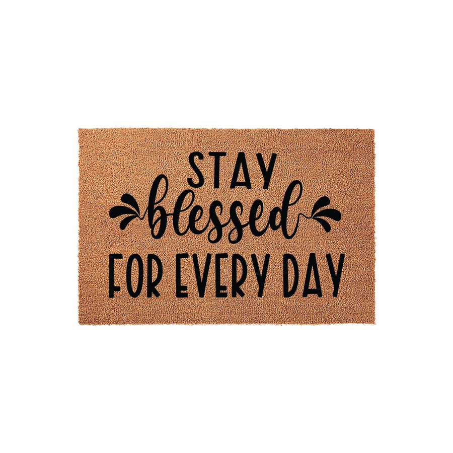 Stay Blessed For Every Day coir doormat featuring a natural tan fiber texture and bold black lettering, providing a welcoming and inspirational touch to your front porch entryway decor with its simple, rustic farmhouse style