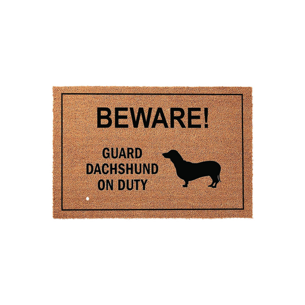 Dachshund Guard Dog Doormat featuring a natural coir texture with a black border and bold text that reads BEWARE! GUARD DACHSHUND ON DUTY, accompanied by a silhouette of a dachshund dog on a plain white studio background.