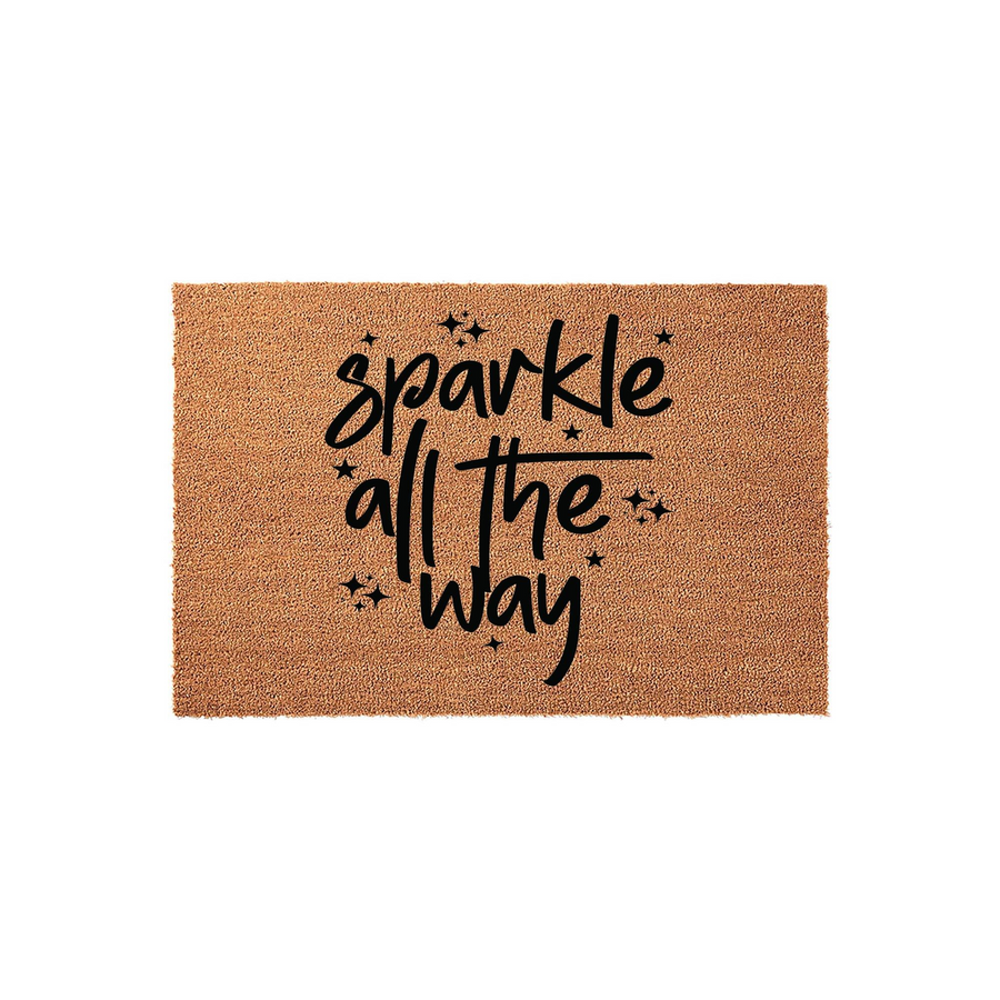 Sparkle All The Way coir doormat featuring a natural brown fiber texture and bold black script lettering, accented with small star icons to create a festive and welcoming entrance for your front porch or home entryway decor.