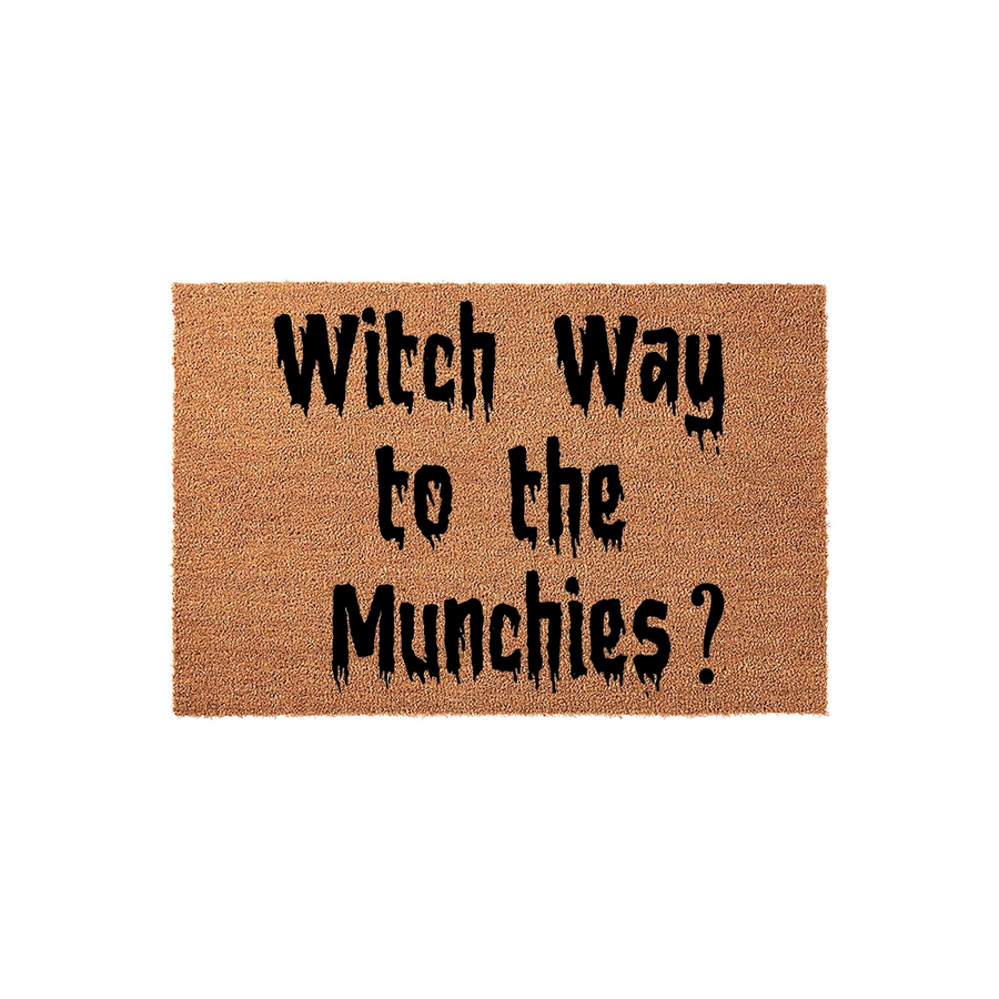 Witch Way to the Munchies Halloween doormat featuring a natural coir texture with black, dripping-style lettering that adds a fun and spooky touch to your front porch decor for the fall season and holiday festivities.
