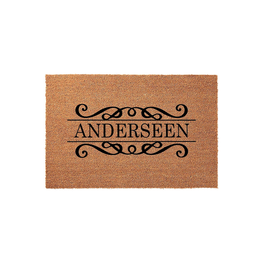 Personalized family name coir doormat featuring a classic black scrollwork design and elegant typography on a natural tan fiber background, creating a welcoming entrance for any home with a custom last name display.