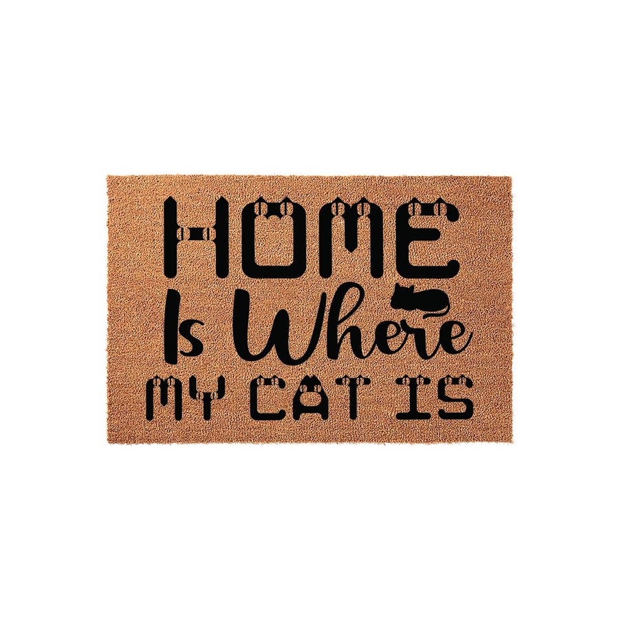 Home Is Where My Cat Is coir doormat featuring a natural brown fiber texture and bold black lettering, with stylized cat ears integrated into the text and a small cat silhouette resting on the word where for a charming pet lover