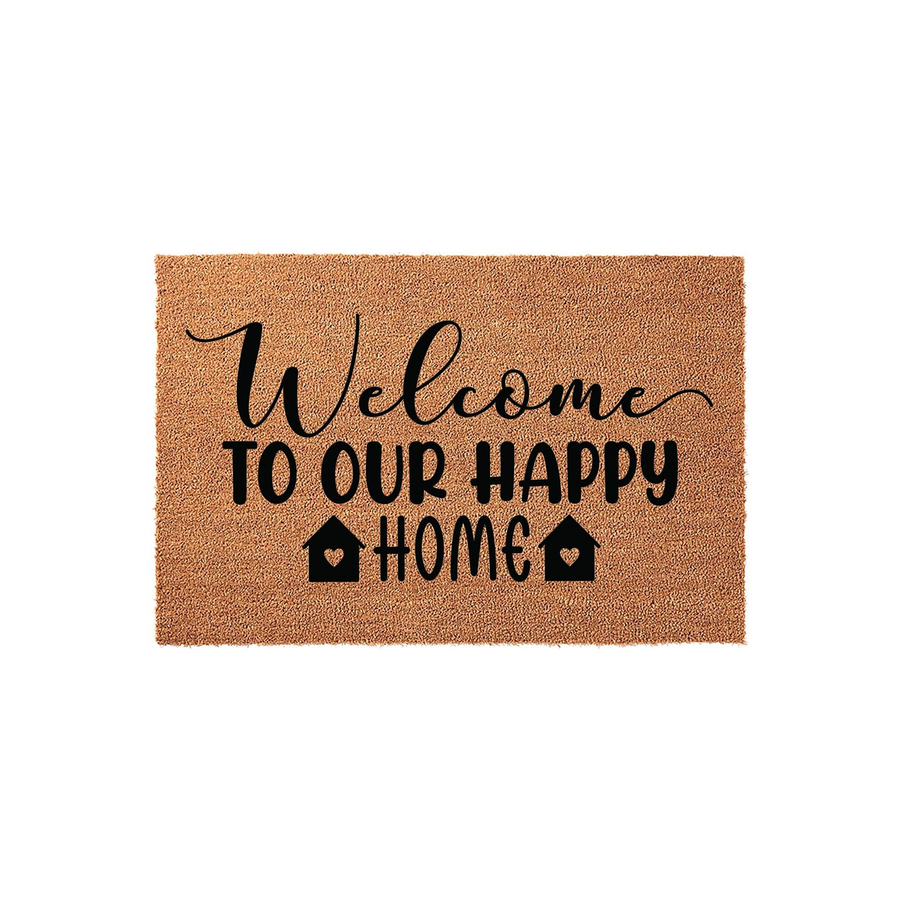 Welcome To Our Happy Home coir doormat featuring black text and house icons on a natural tan fiber background, providing a warm and inviting entrance for any front porch or entryway decor in a clean, studio-style product