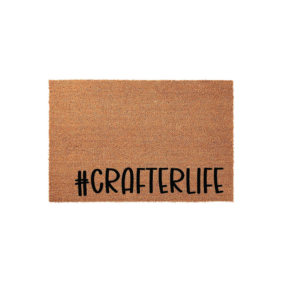 Crafterlife coir doormat featuring a natural brown fiber texture and bold black lettering that reads #CRAFTERLIFE, displayed against a clean white background for a modern and functional home entryway decor piece.