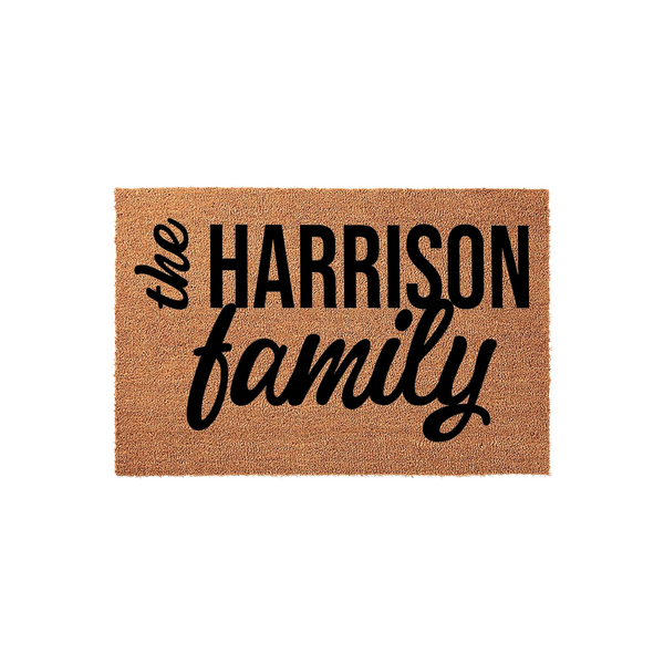 Personalized family name coir doormat featuring bold black typography on a natural tan textured background, creating a welcoming entrance piece for any home that showcases a custom last name in a modern and clean design style.
