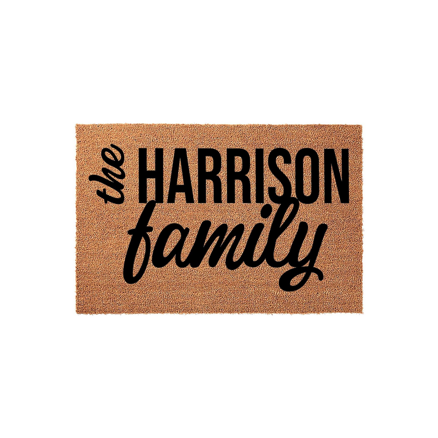 Personalized family name coir doormat featuring bold black typography on a natural tan textured background, creating a welcoming entrance piece for any home that showcases a custom last name in a modern and clean design style.