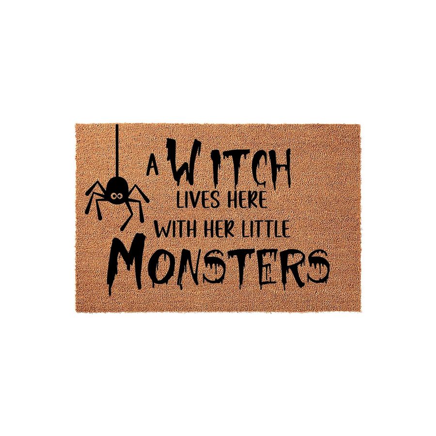 A Witch Lives Here With Her Little Monsters Halloween doormat featuring a natural coir texture and black printed text with a cute spider graphic, making it a fun and spooky seasonal decoration for your front porch entryway this