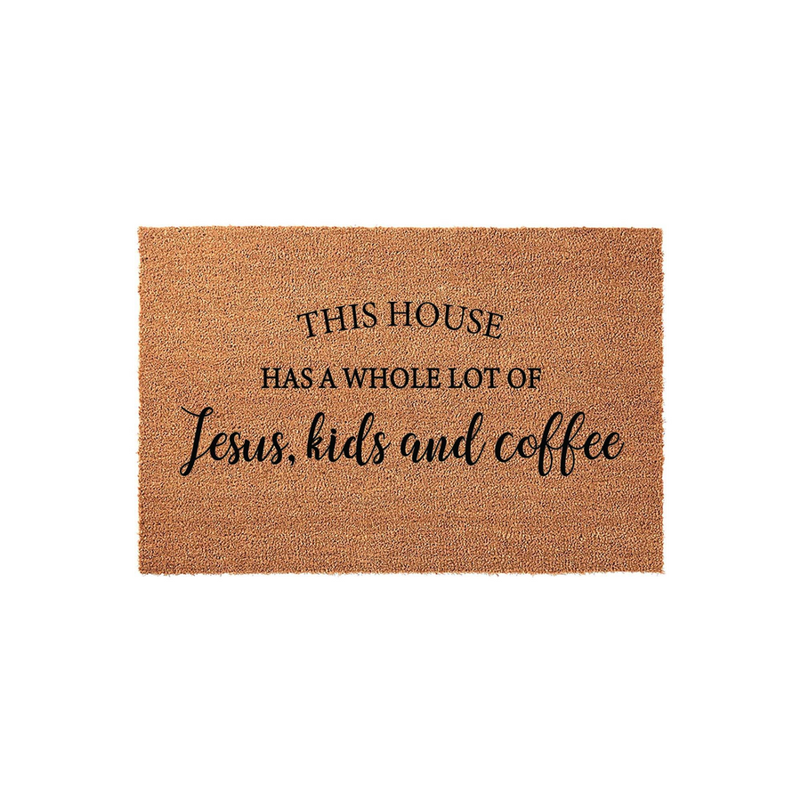This House Has A Whole Lot Of Jesus, Kids And Coffee coir doormat features a natural tan fiber texture with bold black lettering, creating a welcoming and humorous front porch decor piece for a busy family home on a plain white