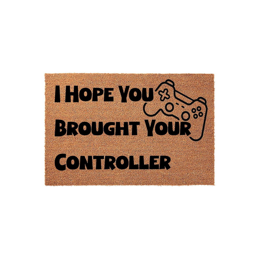 Gaming Welcome Doormat featuring a natural coir texture and bold black text that reads I Hope You Brought Your Controller, complete with a simple line-art video game controller icon for a fun entryway decor piece for any gamer