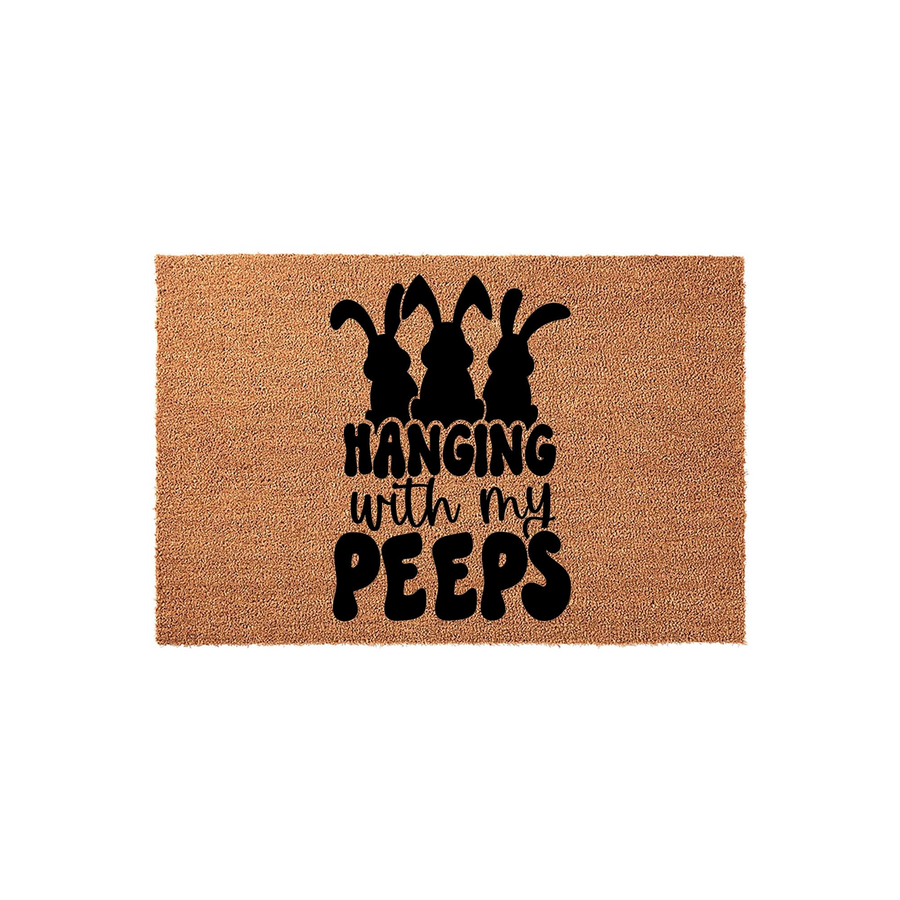 Hanging with my Peeps Easter doormat featuring a natural coir texture and black silhouette graphics of three bunnies, creating a festive spring entryway decor piece for your front porch or home entrance during the holiday season.
