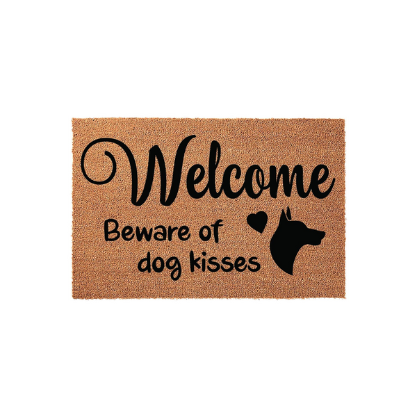 Doberman Pinscher Welcome Doormat featuring a natural coir texture with black printed text that reads Welcome Beware of dog kisses, accompanied by a silhouette of a Doberman dog head and a small heart icon on a plain white