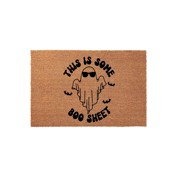 Funny Halloween doormat featuring a cute ghost wearing sunglasses with the text This Is Some Boo Sheet printed in black ink on a natural brown coir fiber background, creating a playful seasonal entryway decor piece for your front