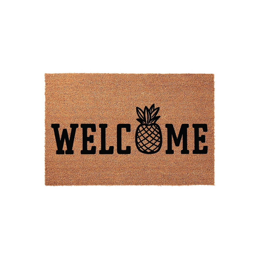 Pineapple Welcome Doormat featuring a natural coir fiber texture and bold black lettering, with a stylized pineapple icon replacing the letter O to create a tropical and inviting entryway decor piece for your front porch or home