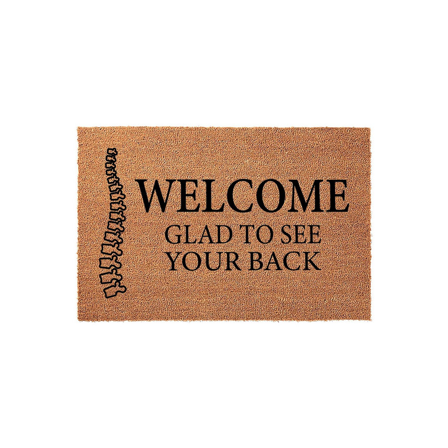 Funny Chiropractic Welcome Doormat featuring a human spine illustration on the left side and the text Welcome Glad To See Your Back printed in black on a natural brown coir fiber mat, perfect for a chiropractor office or home