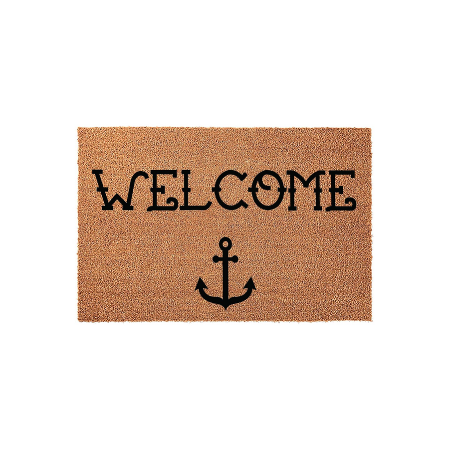 Nautical Welcome Doormat featuring a natural coir texture with a bold black anchor icon and stylized lettering centered on the mat, creating a classic coastal aesthetic for a front porch or entryway decor theme in a clean studio