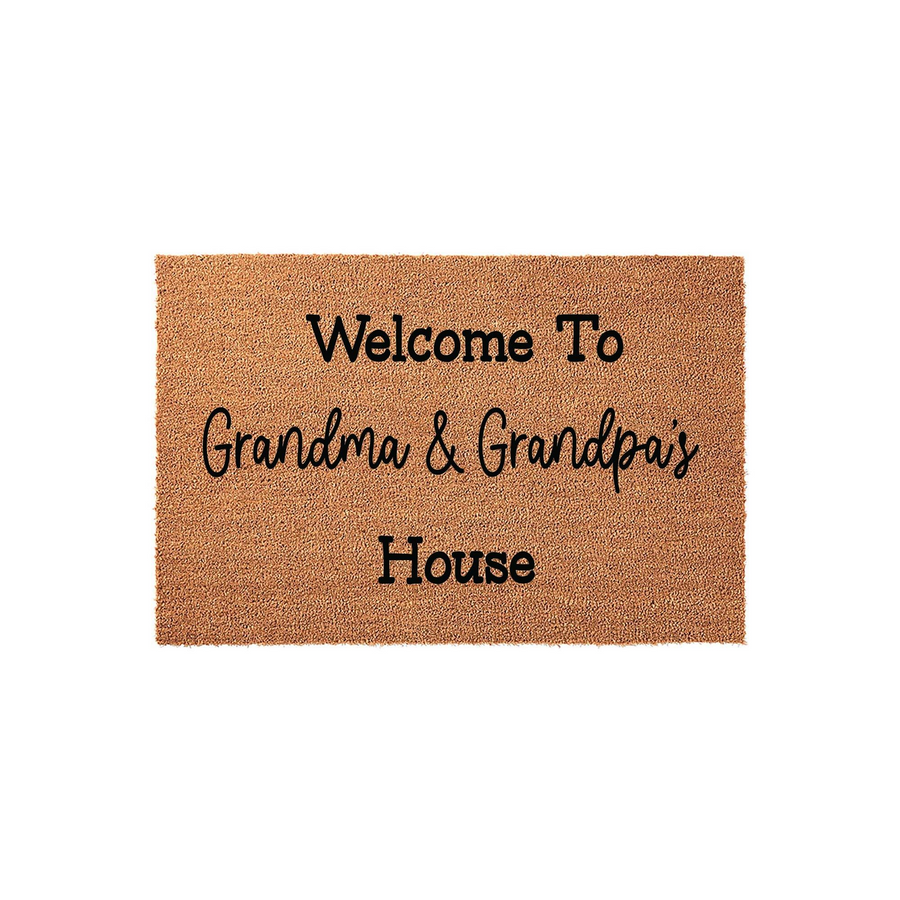 Welcome to Grandma and Grandpa's House doormat featuring a natural coir texture with bold black lettering, creating a warm and inviting entryway accessory for a grandparent's home on a clean, solid white studio background.