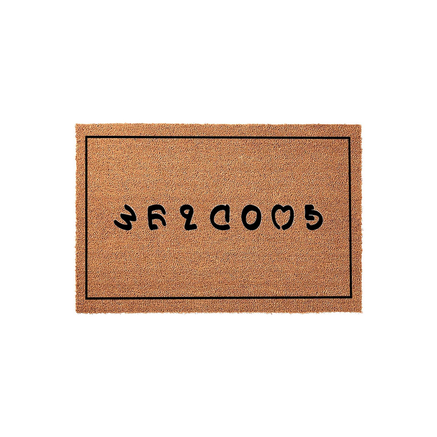 Goodbye doormat with a natural coir texture and a simple black border, featuring the word Goodbye printed in a playful, rounded black font centered on the mat to add a humorous touch to your front porch entryway decor.