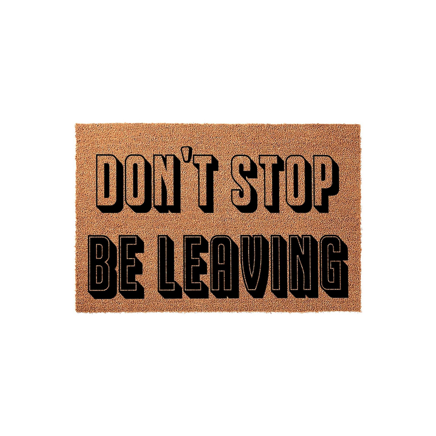 Funny Doormat with the text Don't Stop Be Leaving printed in bold black letters with a drop shadow effect on a natural tan coir fiber background, creating a humorous welcome mat for your front porch or entryway decor.