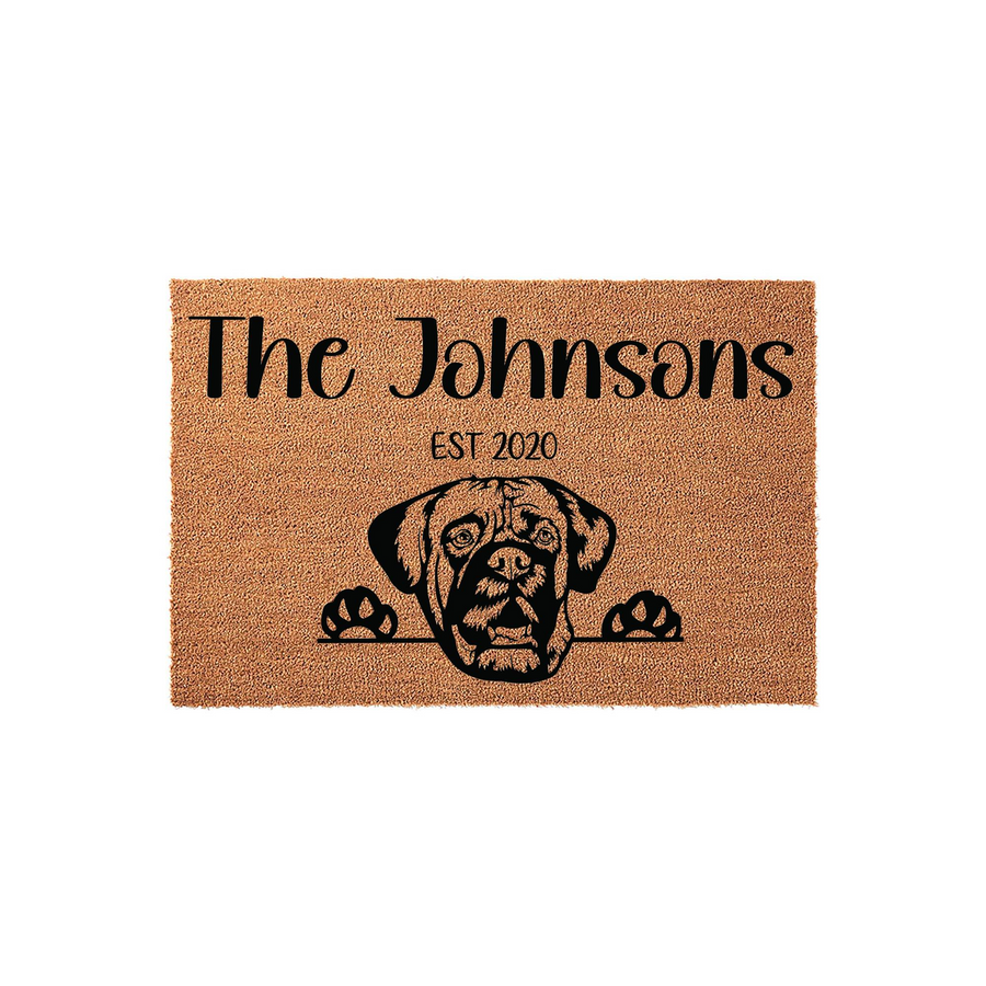 Personalized Boxer dog doormat featuring a natural coir texture with a black printed illustration of a Boxer dog peeking over its paws, customized with a family name and established year on a clean white studio background.