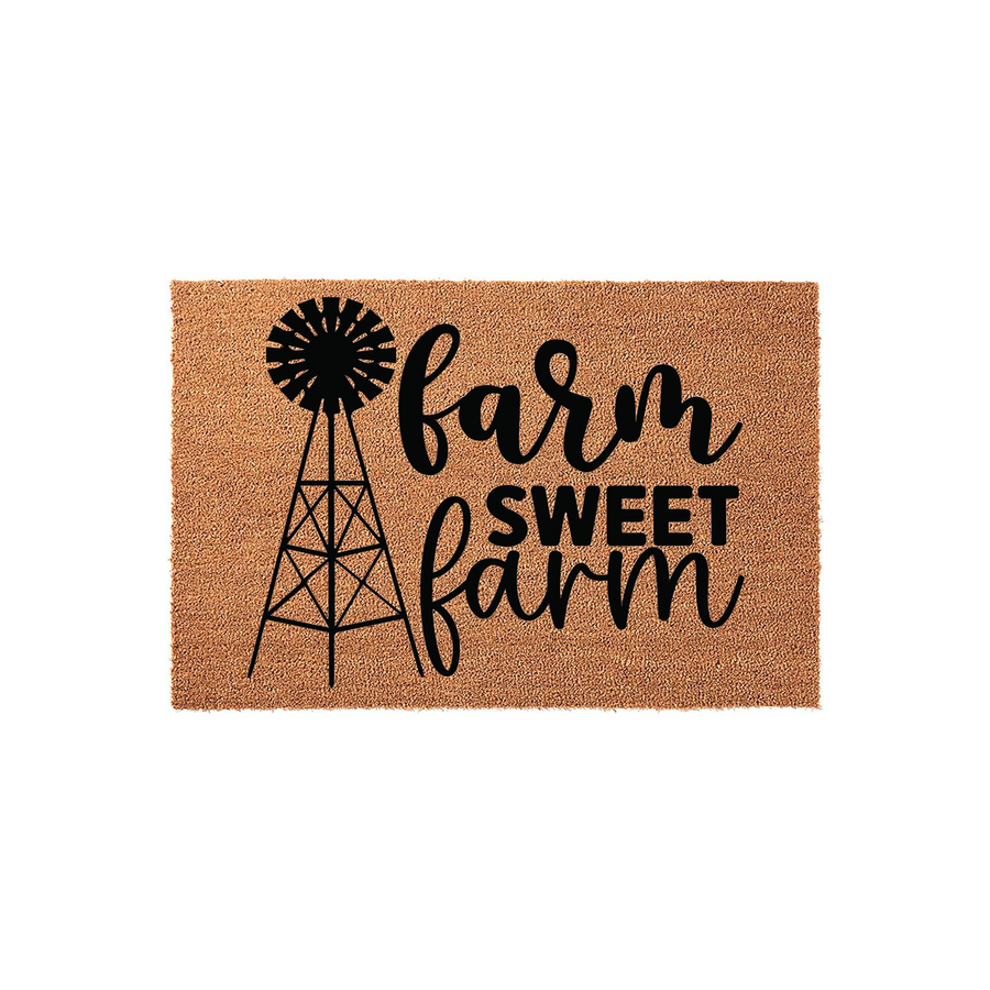 Farm Sweet Farm coir doormat featuring a black windmill graphic and rustic farmhouse typography on a natural brown coconut fiber background, creating a welcoming entrance decor piece for any country style home or front porch.