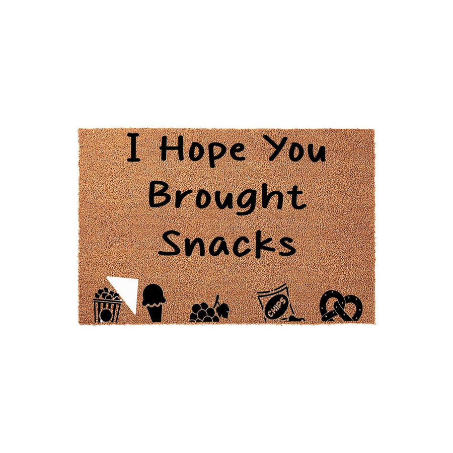 I Hope You Brought Snacks funny doormat featuring a natural coir texture with black text and cute icons of popcorn, ice cream, grapes, chips, and a pretzel printed along the bottom edge against a clean white studio background.