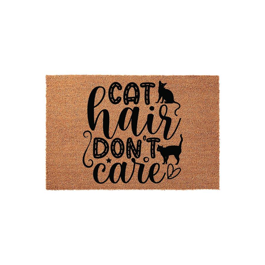 Cat Hair Don't Care coir doormat featuring a natural brown fiber texture with bold black typography and two playful cat silhouettes, making it a fun and durable entryway rug for any cat lover's home decor and front porch entrance.