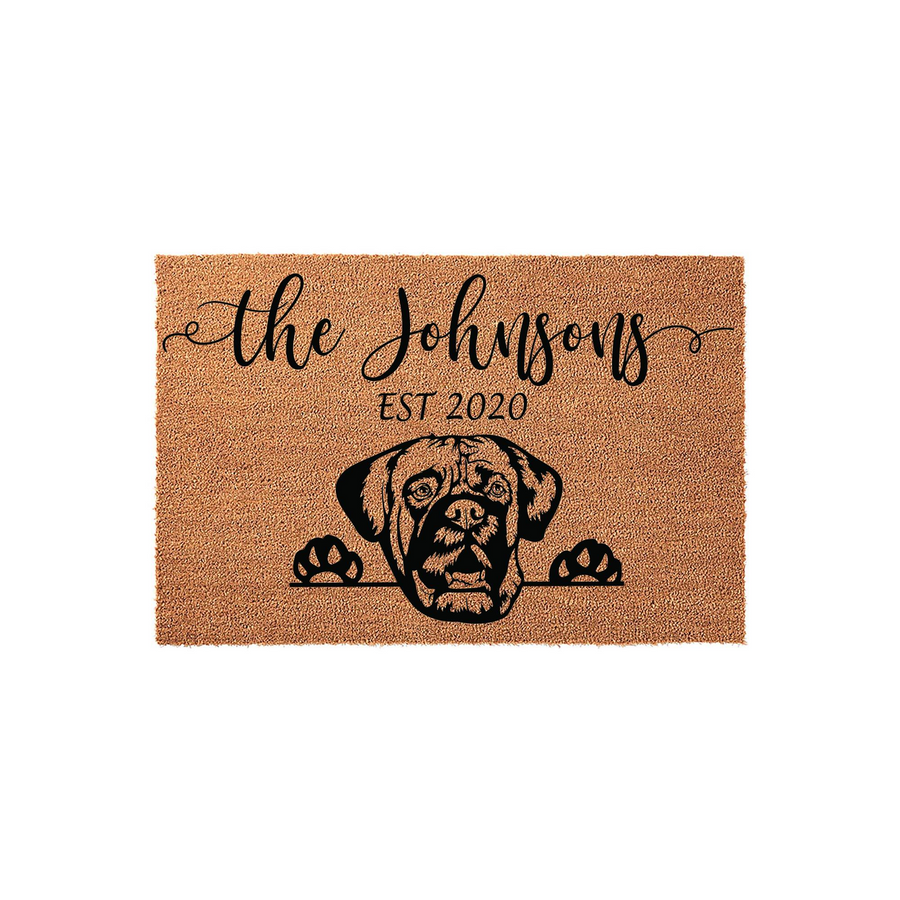 Personalized Boxer dog doormat featuring a natural coir texture with a black graphic of a Boxer dog peeking over the edge, customized with a family name and established year in elegant script and clean block lettering on a plain