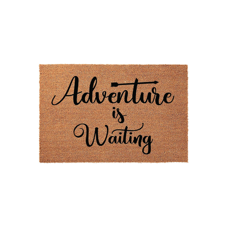 Adventure is Waiting coir doormat featuring a natural brown fiber texture and bold black script lettering, providing a welcoming and rustic outdoor entrance decor piece for any home entryway or porch setting.