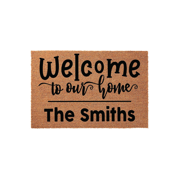 Personalized Welcome to Our Home doormat featuring a natural coir texture with black printed text that includes a customizable family name, making it a functional and inviting entryway decor piece for any house or apartment front