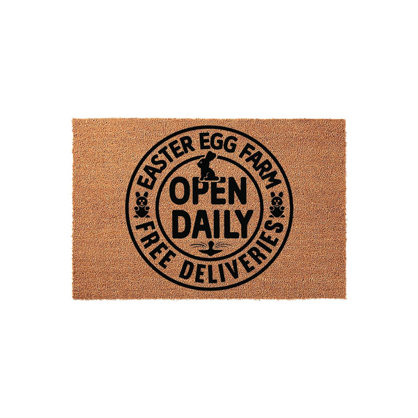 Easter Egg Farm Doormat featuring a circular black design on a natural coir background, with a bunny silhouette and the text Open Daily Free Deliveries printed in the center for a festive spring home decor entrance.