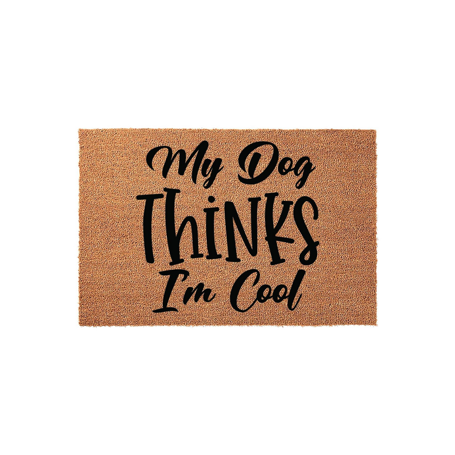 My Dog Thinks I am Cool coir doormat featuring bold black typography on a natural brown fiber background, making this funny pet-themed welcome mat a charming addition to any dog lover's front porch or entryway decor for the home.