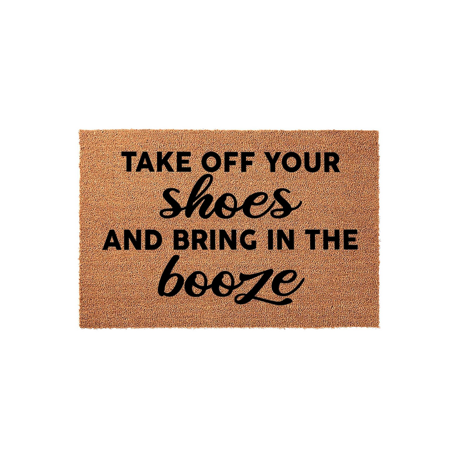 Funny Coir Doormat with the text Take Off Your Shoes And Bring In The Booze printed in a mix of bold sans-serif and elegant script fonts, featuring a natural brown fiber texture isolated against a clean white studio background.