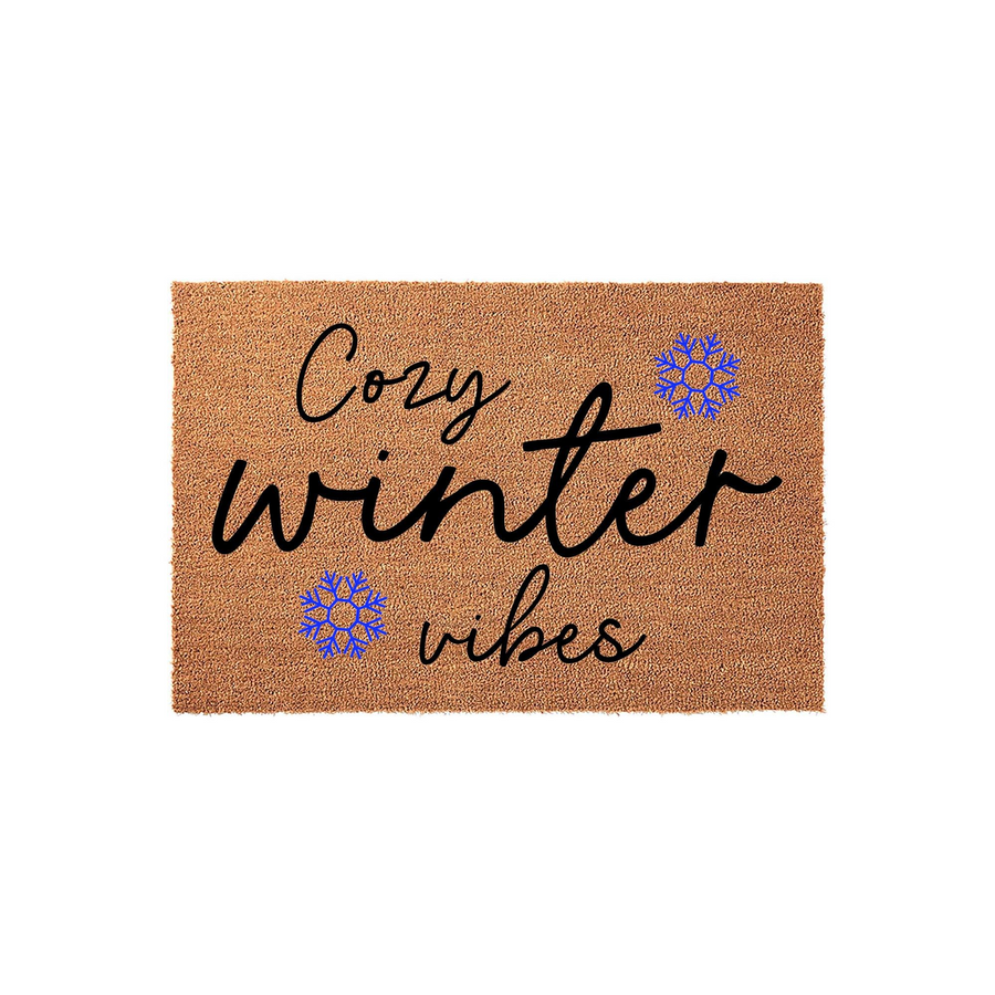Cozy Winter Vibes Coir Doormat featuring a natural brown fiber texture with black cursive lettering and two bright blue snowflake icons, creating a festive seasonal entrance decor piece for your front porch or home entryway.