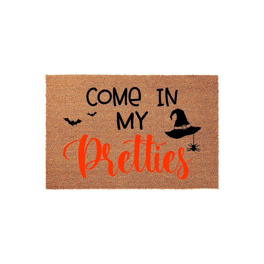 Halloween Witch Doormat featuring the text Come In My Pretties in black and orange script, decorated with a black witch hat, a hanging spider, and flying bats on a natural tan coir background for a festive seasonal front porch