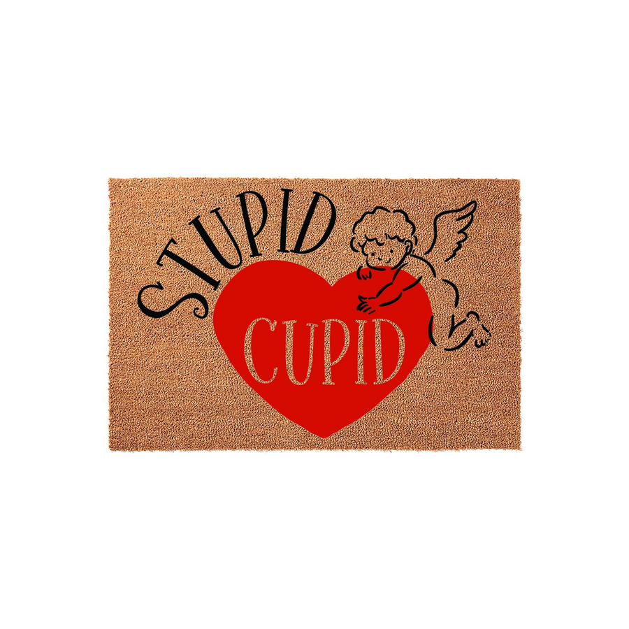 Stupid Cupid Valentine doormat featuring a natural coir texture with a large red heart graphic, a playful cherub illustration, and bold black and gold lettering that adds a humorous touch to your home entryway decor for the